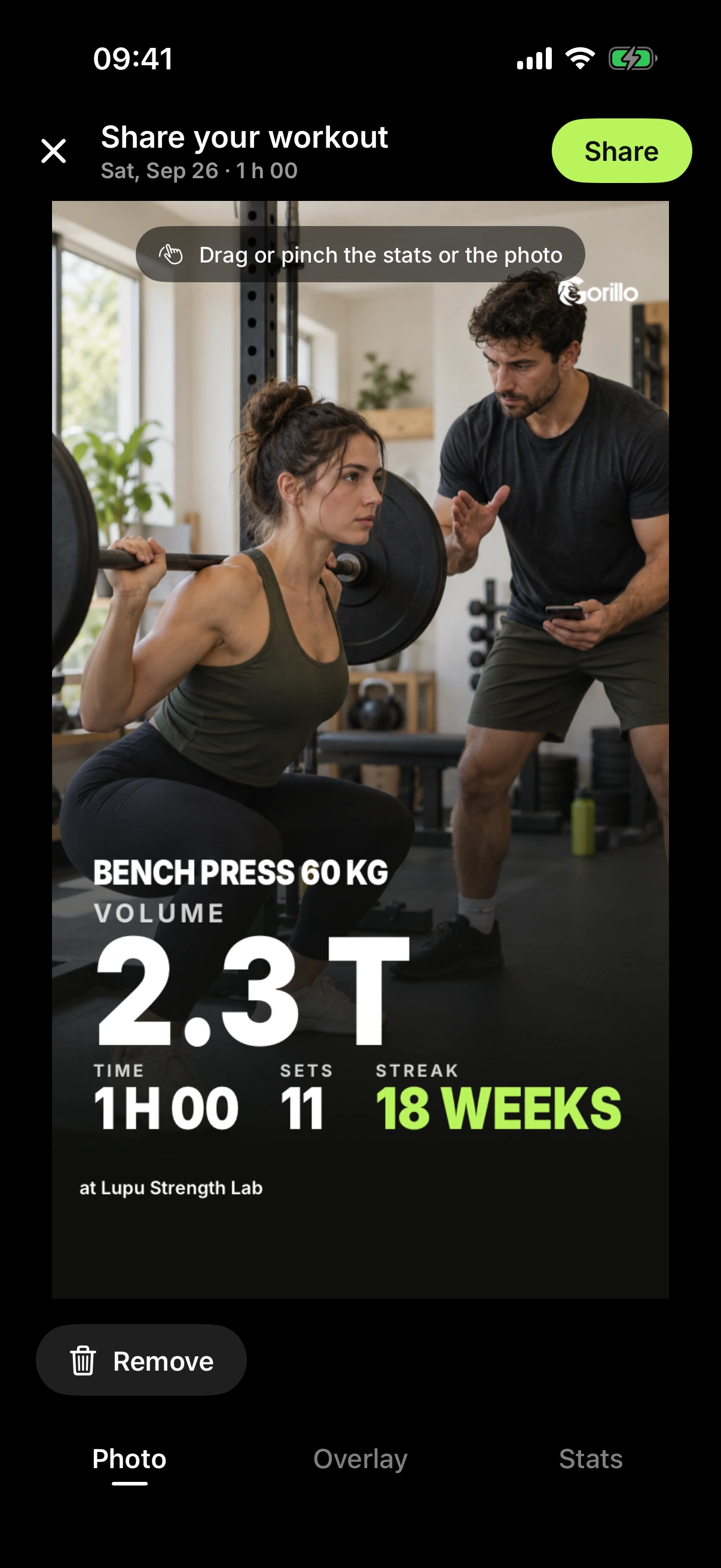 A client’s workout post: best lift, session volume, sets and an 18-week streak over their photo.